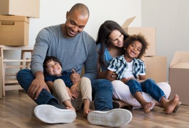 Happy family moving into a home