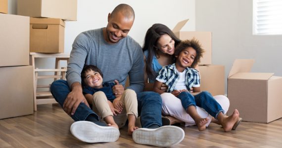 Happy family moving into a home