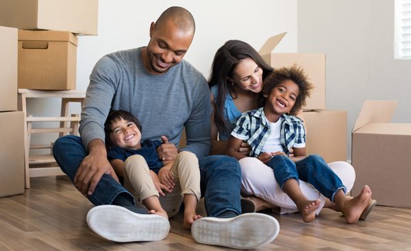 Happy family moving into a home